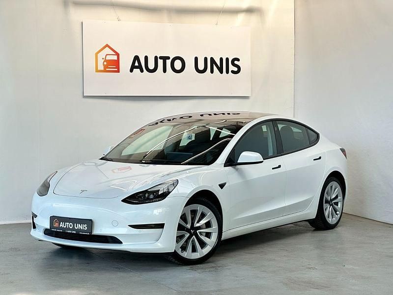 Weiß Gebraucht 2022 Tesla Model 3 Standard Range Plus Limousine | 24.871 € (Guter Preis) - Bild 1/4