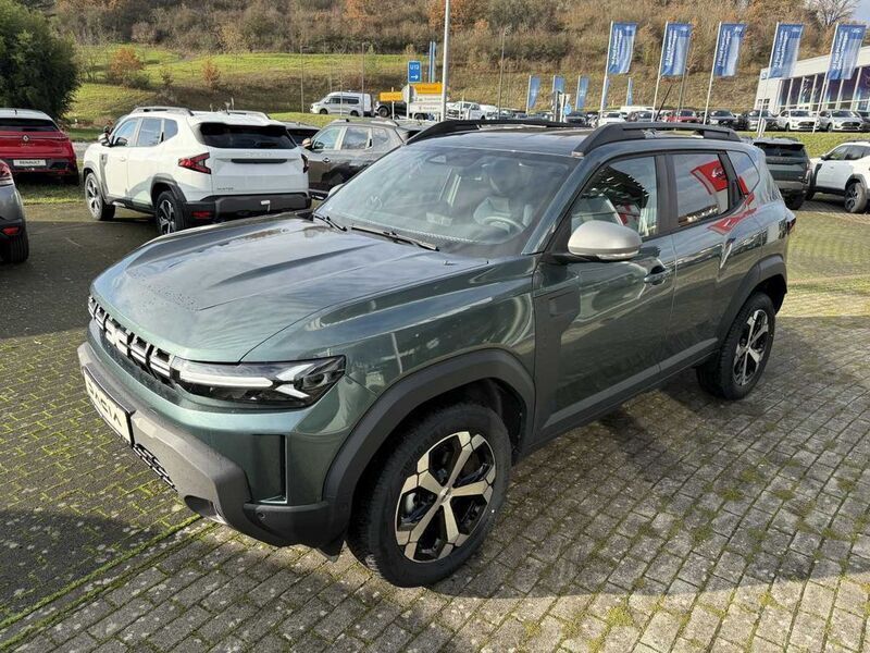 Zedern grün metallic Neu 2025 Dacia Duster Journey SUV | 31.550 € (Teuer) - Bild 1/4