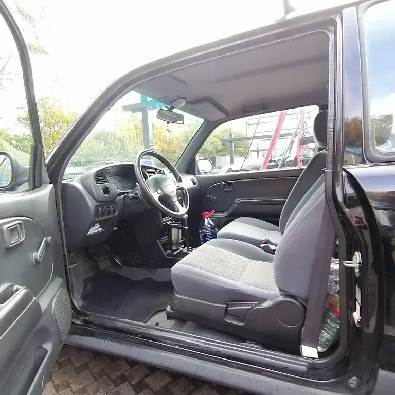 Gebraucht Daihatsu Cuore 56 PS (41 kW) 2002 Schwarz Kleinwagen