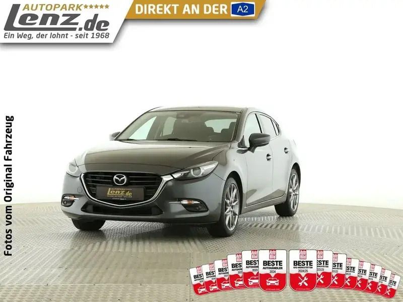 Matrixgrau metallic Gebraucht 2018 Mazda 3 Signature Limousine | 14.930 € (Fairer Preis) - Bild 1/3