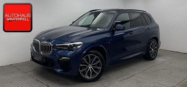 Phytonicblau metallic (metallic) Gebraucht 2019 BMW X5 Sport Line SUV | 43.800 € (Guter Preis) - Bild 1/4