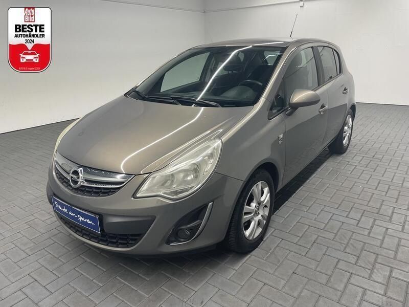 Braun (muskatbraunmet.) Gebraucht 2012 Opel Corsa Kleinwagen | 8.980 € (Teuer) - Bild 1/4