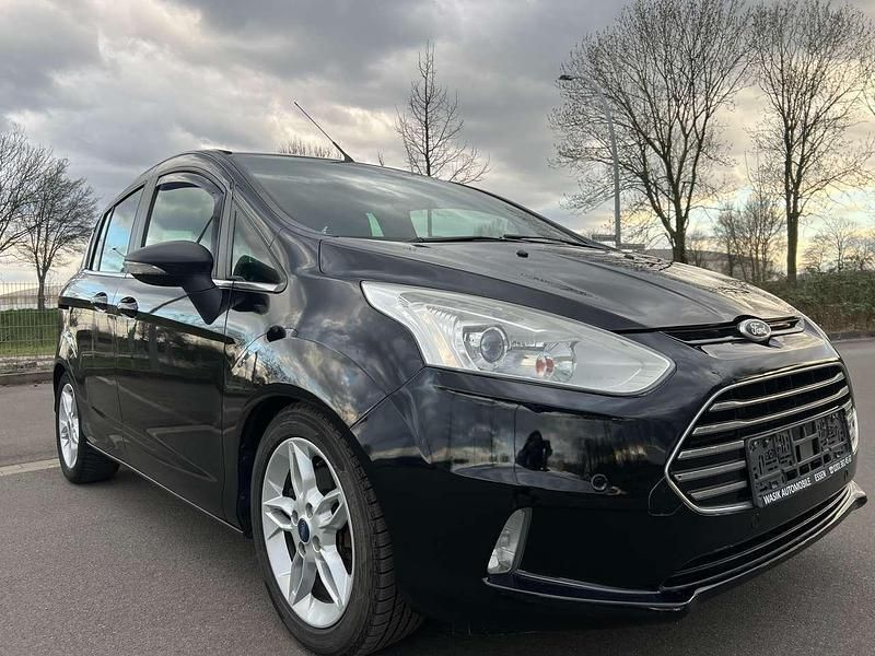 Pantherschwarz metallic Gebraucht 2013 Ford B-MAX Individual Van / Kleinbus | 6.990 € (Fairer Preis) - Bild 1/4
