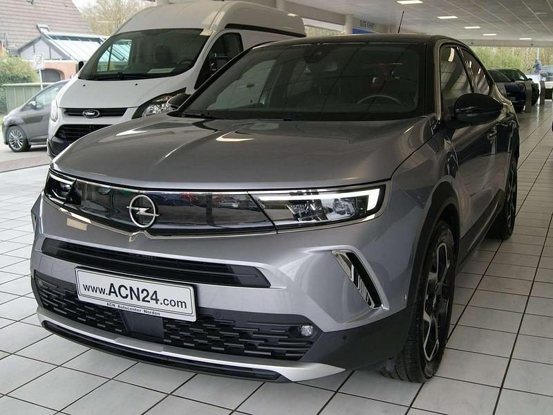 Gebraucht Opel Mokka-e Ultimate 100 kW (136 PS) 2021 Kontrast grau/quarz silber SUV