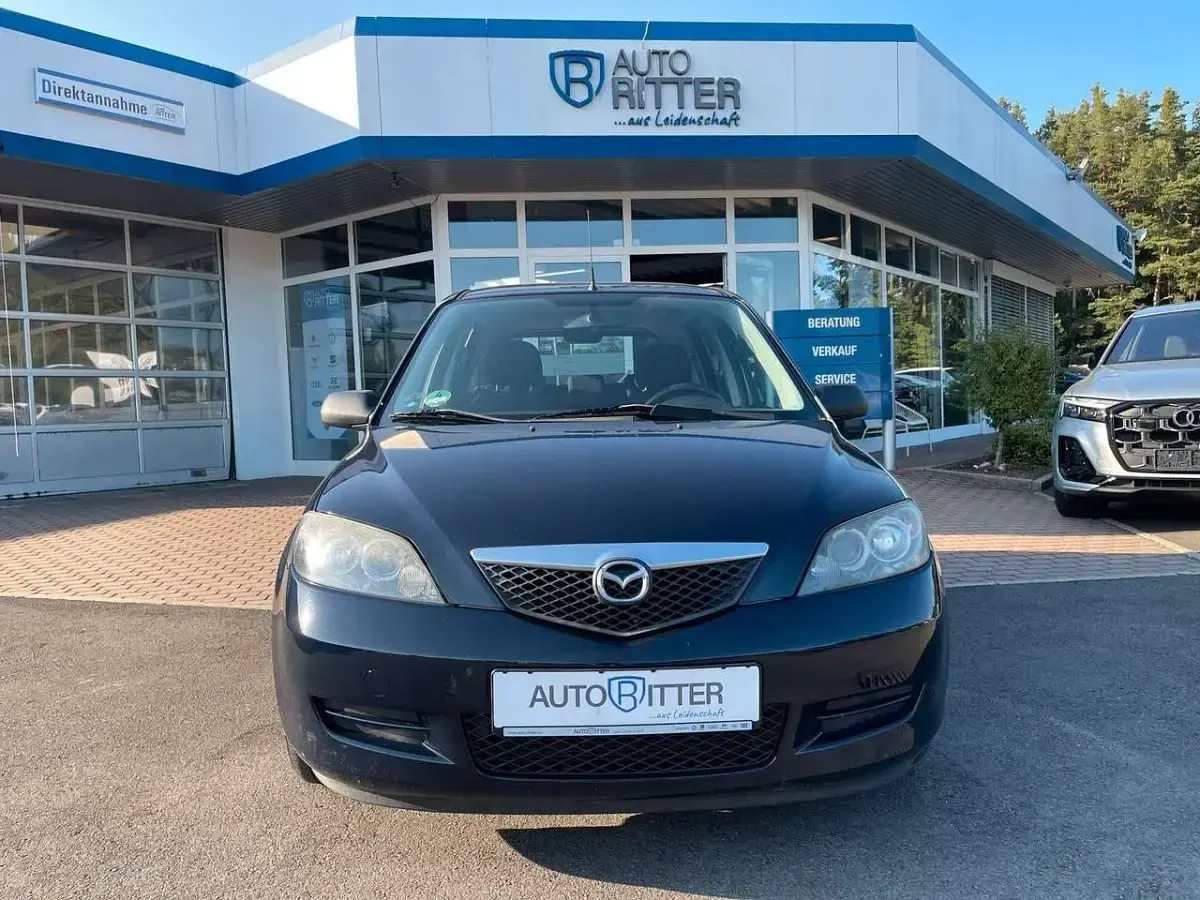 Używany Mazda 2 Comfort 75 KM (55 kW) 2006 Niebieski Hatchback