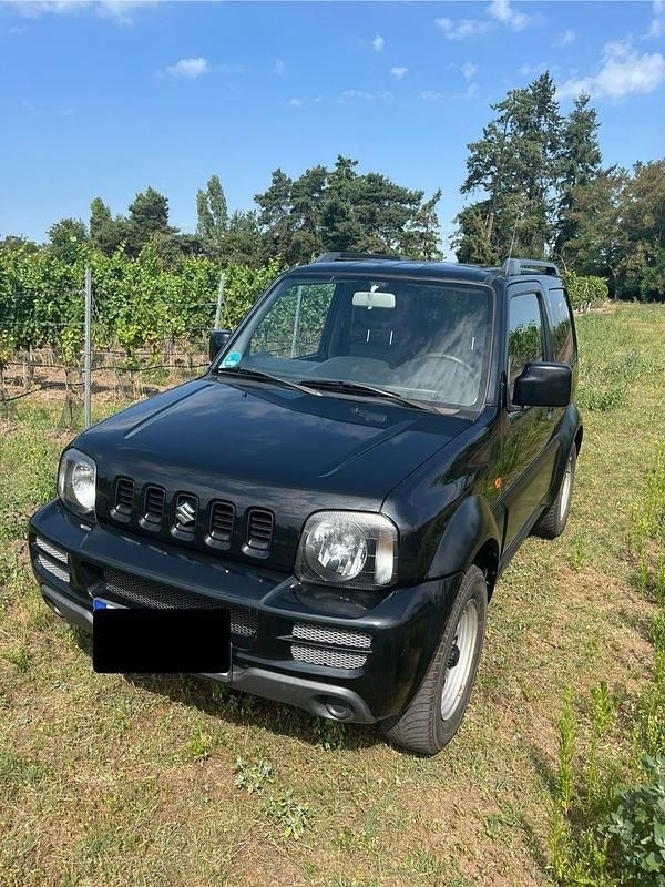 Schwarz Gebraucht 2010 Suzuki Jimny Club SUV | 10.900 € (Fairer Preis) - Bild 1/4
