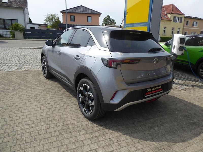 Gebraucht Opel Mokka-e Ultimate 100 kW (136 PS) 2023 Kontrast grau metallic SUV