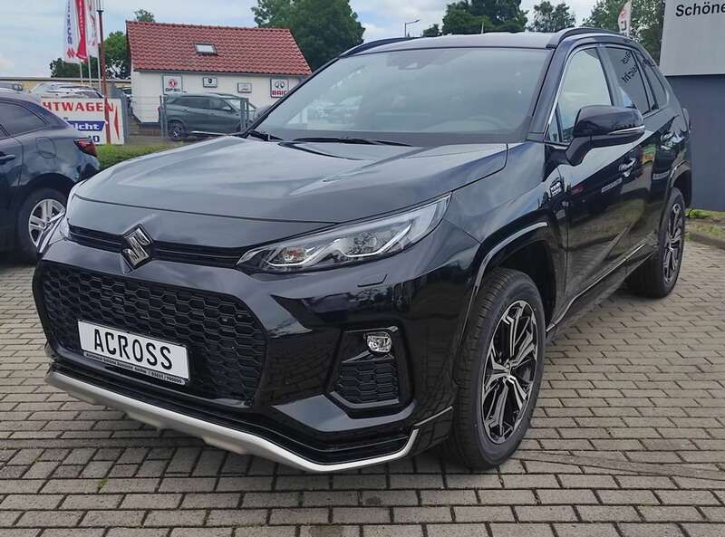Schwarz (attitude black mica met.) Gebraucht 2024 Suzuki Across Comfort+ SUV | 49.990 € (Teuer) - Bild 1/4