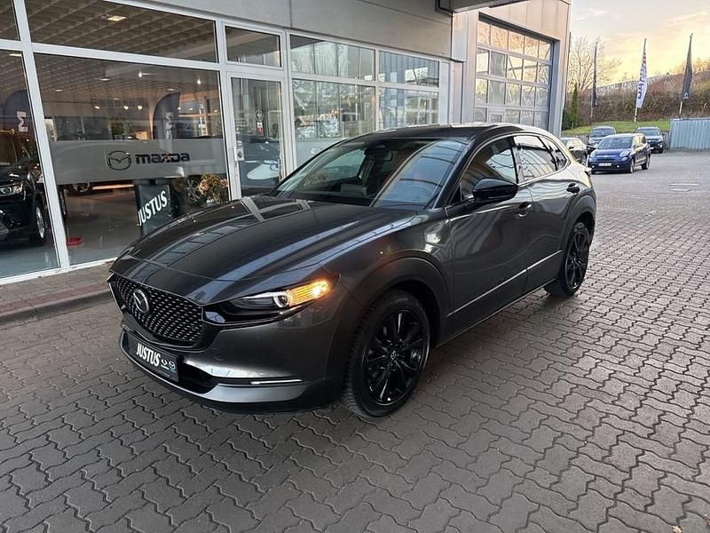 Machine gray (metallic) Gebraucht 2024 Mazda CX-30 Nagisa SUV | 27.990 € (Fairer Preis) - Bild 1/4