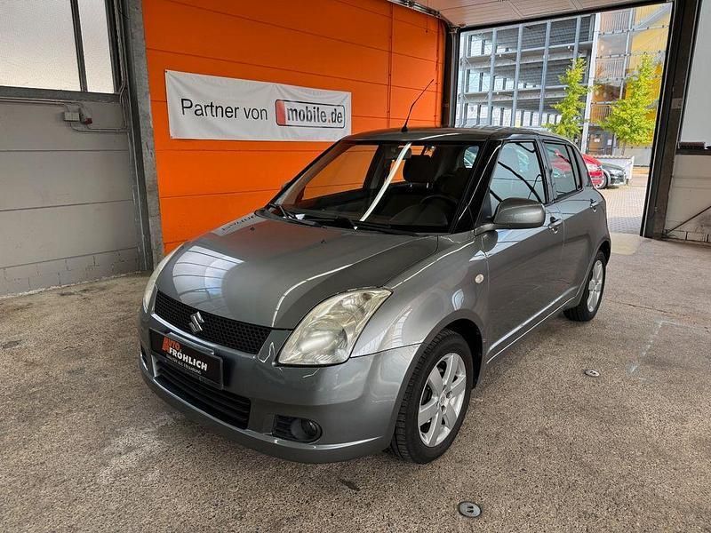 Grau Gebraucht 2010 Suzuki Swift Comfort Limousine | 3.999 € (Fairer Preis) - Bild 1/4
