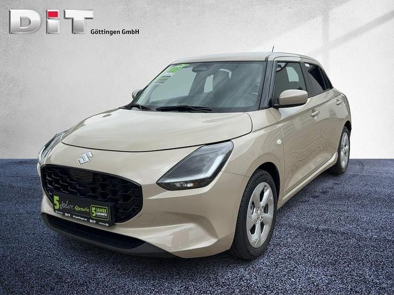 Gold Neu 2025 Suzuki Swift Comfort Limousine | 17.990 € - Bild 1/4