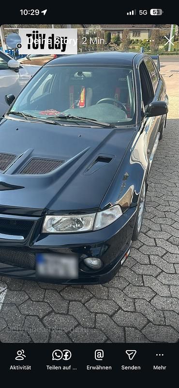 Second-hand Mitsubishi Lancer Evolution 300 CP (220 kW) 2000 Negru Berlinǎ