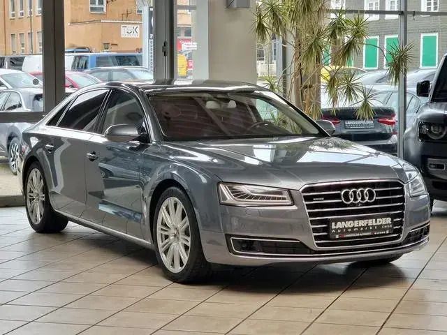 Monsungrau metallic Gebraucht 2014 Audi A8L Limousine | 26.999 € (Teuer) - Bild 1/4