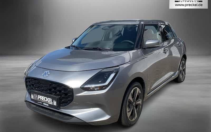 Silber Neu 2025 Suzuki Swift Comfort+ Kleinwagen | 21.490 € - Bild 1/4