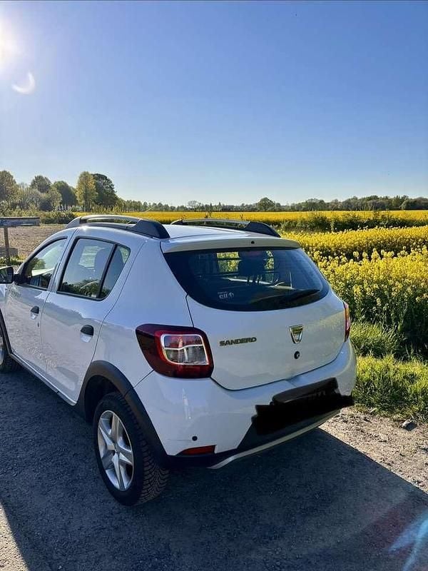 Używany Dacia Sandero Prestige 90 KM (66 kW) 2014 Biały Hatchback