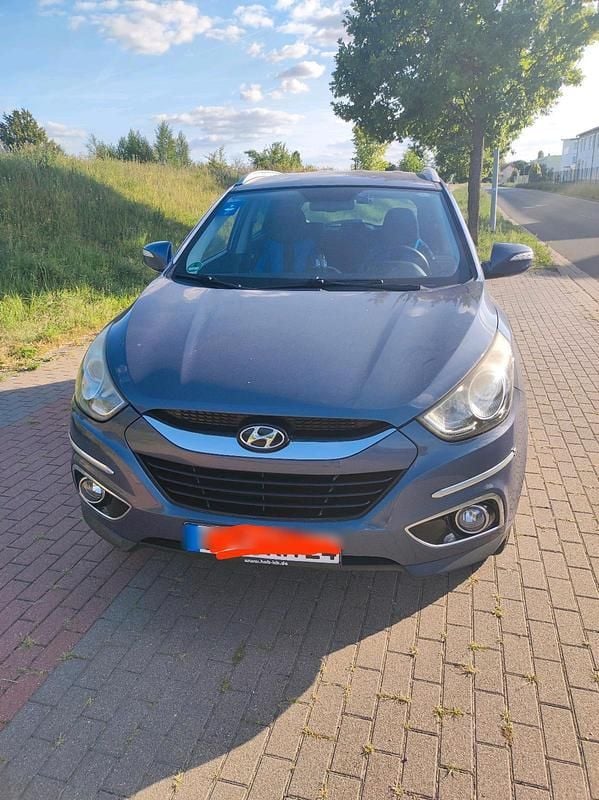 Blau Gebraucht 2012 Hyundai Tucson SUV | 8.600 € (Fairer Preis) - Bild 1/4