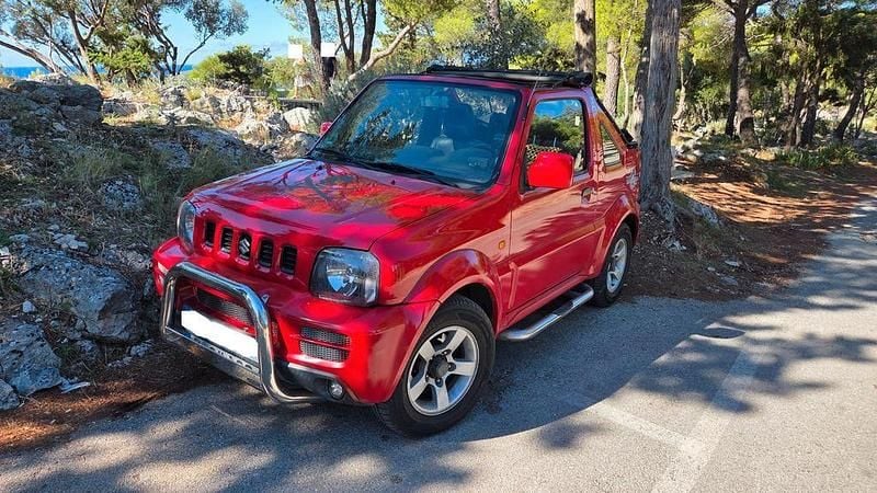 Rot Gebraucht 2008 Suzuki Jimny SUV | 9.600 € (Fairer Preis) - Bild 1/4