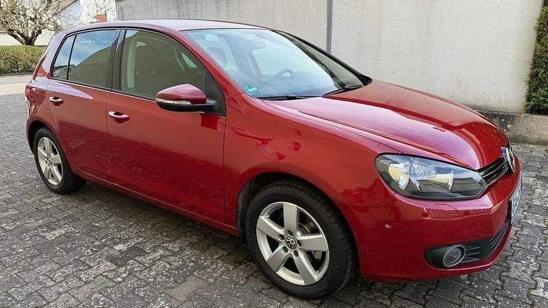 Gebraucht VW Golf VI Team 105 PS (77 kW) 2011 Orange Kleinwagen