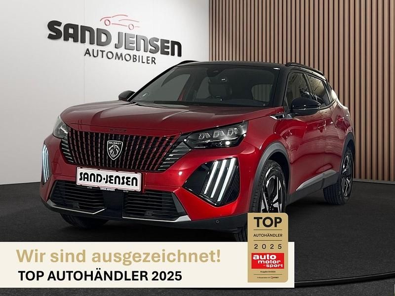 Elixir rot metallic Gebraucht 2024 Peugeot e-2008 SUV | 24.994 € (Superpreis) - Bild 1/4