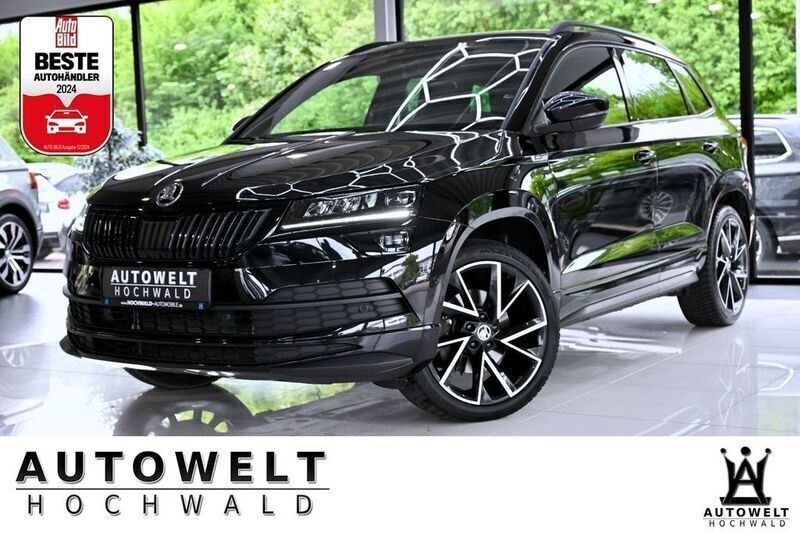 Schwarz Gebraucht 2022 Skoda Karoq SportLine SUV | 28.990 € - Bild 1/4
