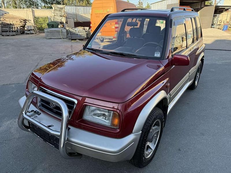 Rot Gebraucht 1996 Suzuki Vitara SUV | 7.900 € (Fairer Preis) - Bild 1/4