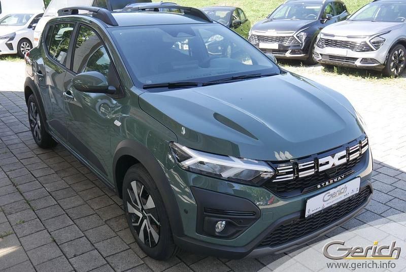 Gebraucht Dacia Sandero Expression 91 PS (66 kW) 2024 Safarigrüngrau metallic Kleinwagen