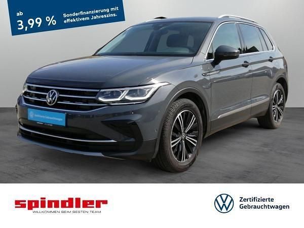 Grau (delfingrau metallic) Gebraucht 2022 VW Tiguan Elegance SUV | 28.381 € (Fairer Preis) - Bild 1/3
