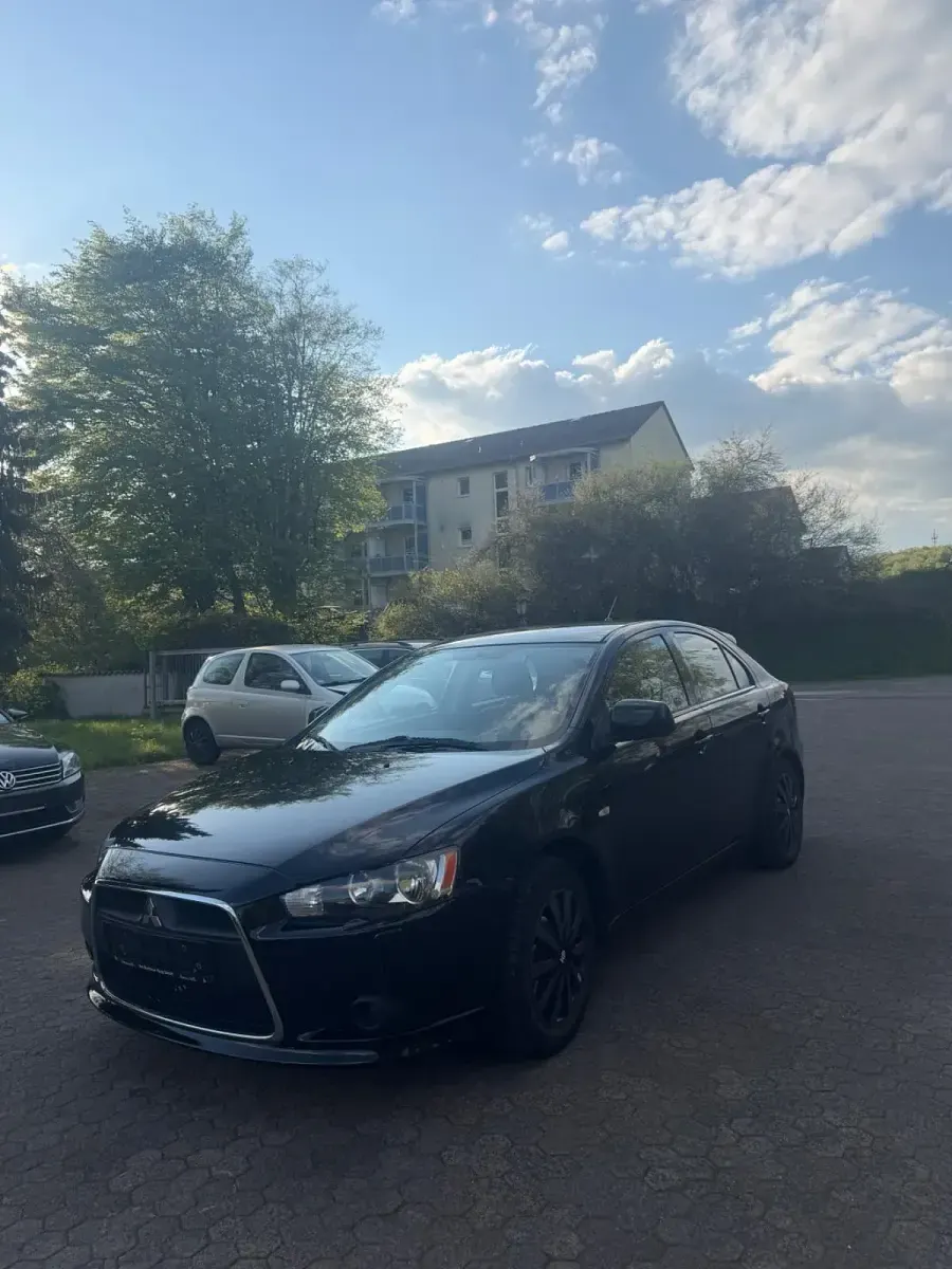Second-hand Mitsubishi Lancer 143 CP (105 kW) 2009 Negru Berlinǎ