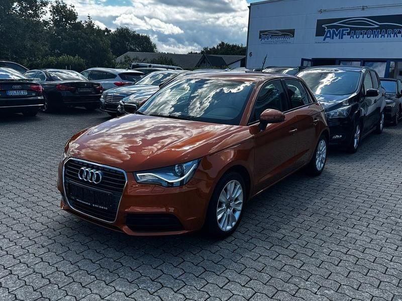 Orange Gebraucht 2013 Audi A1 Sportback Attraction Kleinwagen | 11.399 € (Fairer Preis) - Bild 1/4