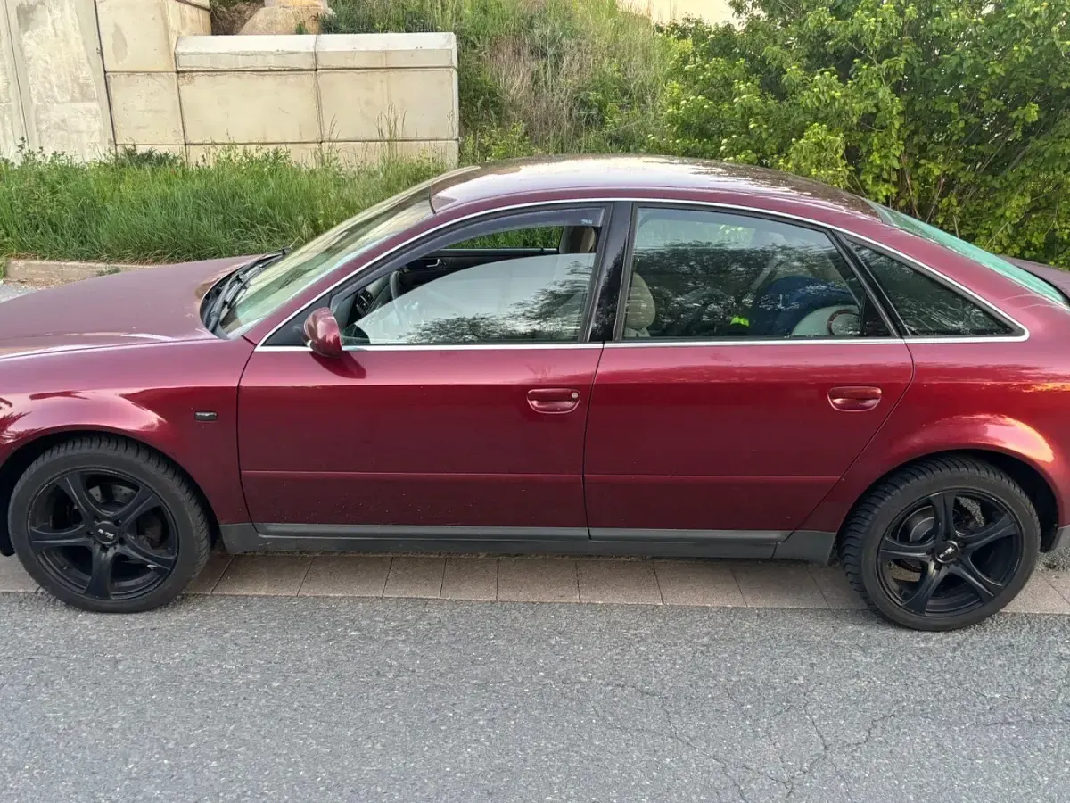 Używany Audi A6 150 KM (110 kW) 1999 Czerwony Sedan/Limuzyna