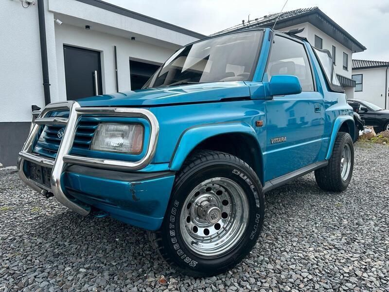 Grün Gebraucht 1993 Suzuki Vitara SUV | 8.649 € - Bild 1/4