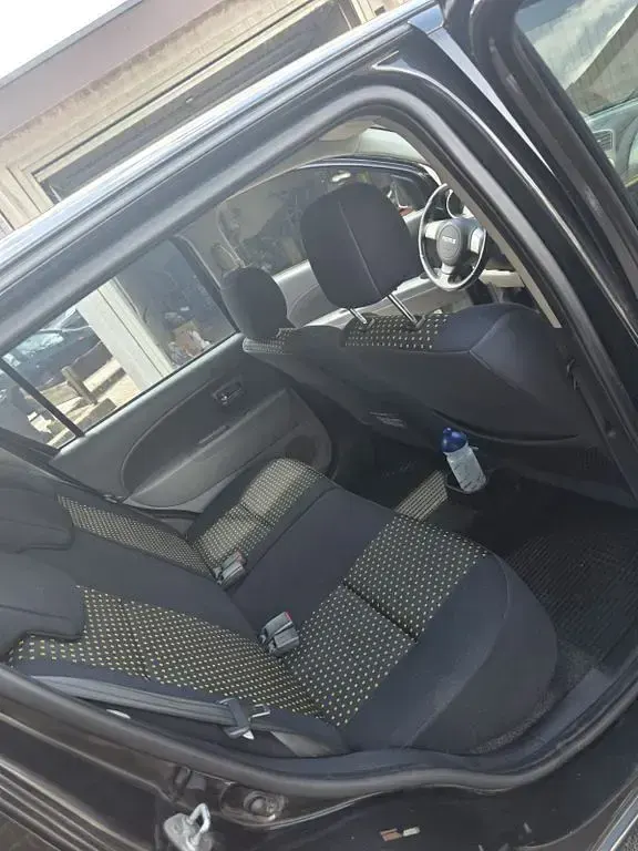 Gebraucht Daihatsu Sirion 91 PS (66 kW) 2008 Schwarz Kleinwagen
