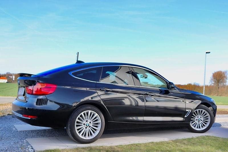 Schwarz Gebraucht 2014 BMW 318 Gran Turismo Luxury Line Limousine | 7.890 € (Guter Preis) - Bild 1/4