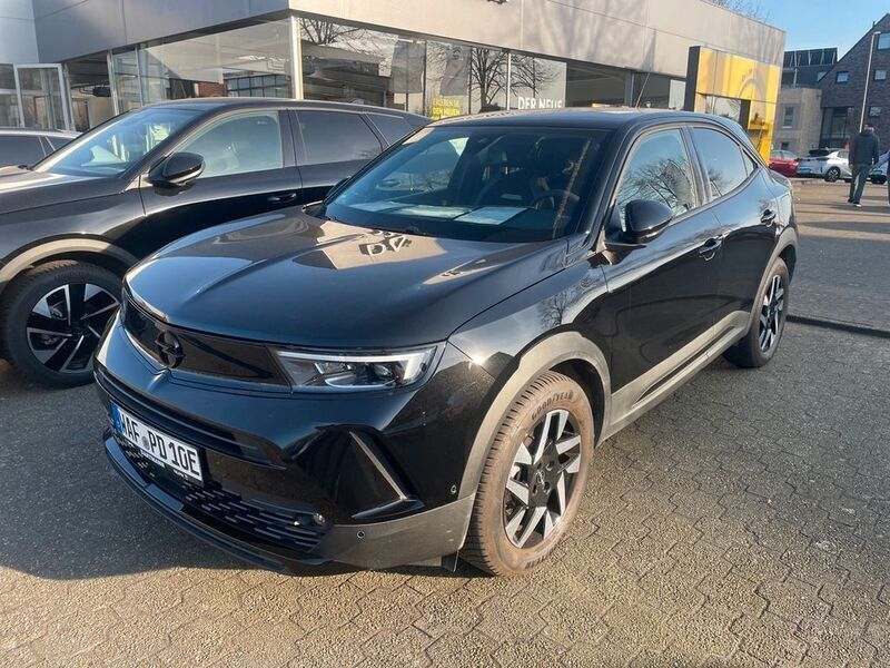 Karbon schwarz Gebraucht 2024 Opel Mokka-e drive SUV | 33.890 € - Bild 1/4