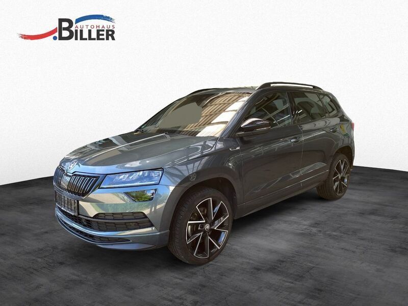 Quarzgrau metallic (metallic) Gebraucht 2021 Skoda Karoq SportLine SUV | 28.490 € (Etwas zu teuer) - Bild 1/4