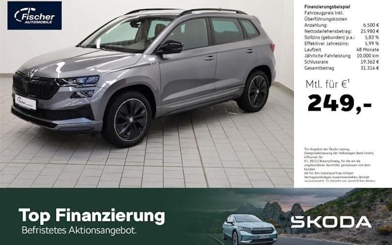 Grau Gebraucht 2022 Skoda Karoq SportLine SUV | 32.440 € (Fairer Preis) - Bild 1/4