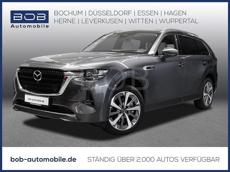 Grau Gebraucht 2024 Mazda CX-80 Takumi-Line SUV | 49.776 € (Guter Preis) - Bild 1/3