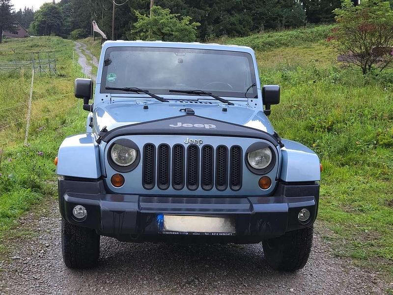 Blau Gebraucht 2012 Jeep Wrangler Sahara SUV | 17.000 € (Superpreis) - Bild 1/4