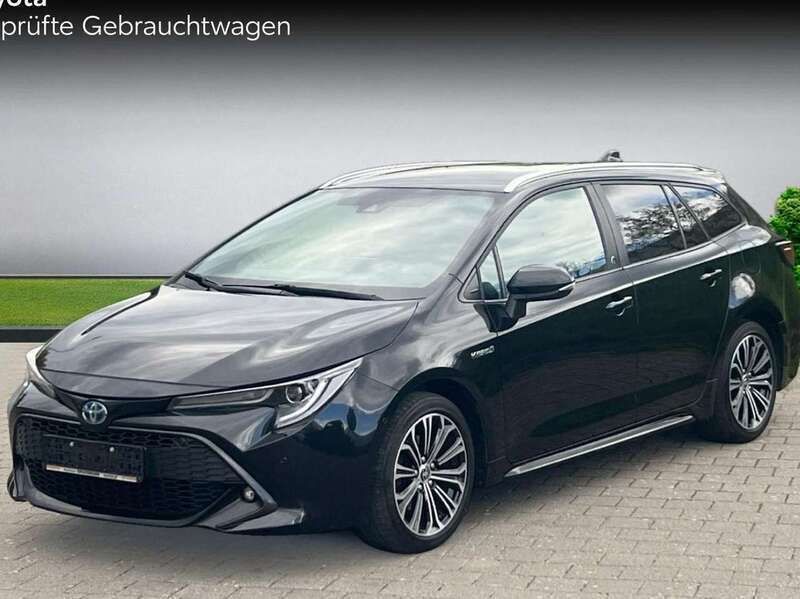 Black mica / ink Gebraucht 2021 Toyota Corolla Hybrid Team Kombi | 22.980 € (Fairer Preis) - Bild 1/4