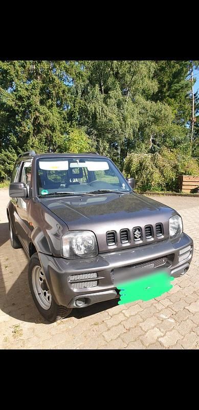 Grau Gebraucht 2012 Suzuki Jimny Ranger SUV | 9.900 € (Guter Preis) - Bild 1/4
