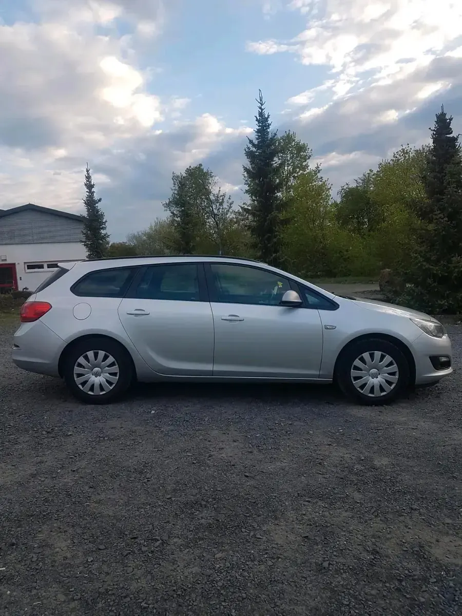 Second-hand Opel Astra 110 CP (80 kW) 2014 Argintiu Break