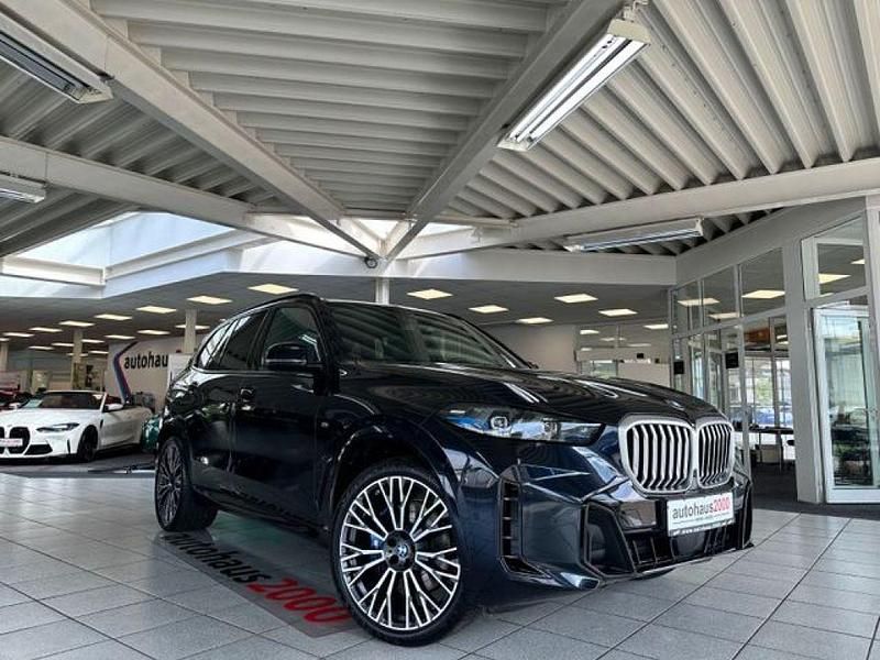 Carbonschwarz metallic Gebraucht 2024 BMW X5 M Sport SUV | 80.950 € (Fairer Preis) - Bild 1/4