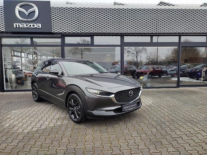 Machine gray (metallic) Gebraucht 2025 Mazda CX-30 Homura-Line SUV | 25.900 € (Superpreis) - Bild 1/4