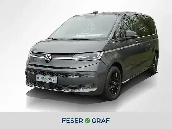 Indiumgrau metallic Gebraucht 2024 VW Multivan Van | 47.411 € (Superpreis) - Bild 1/3