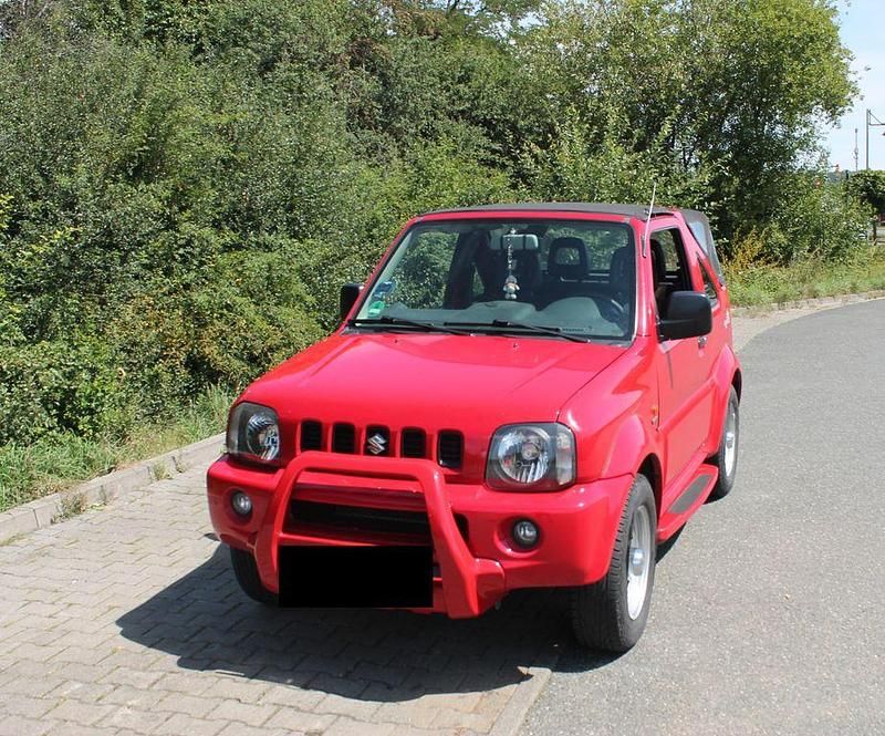 Rot Gebraucht 2005 Suzuki Jimny Club SUV | 9.499 € (Teuer) - Bild 1/4