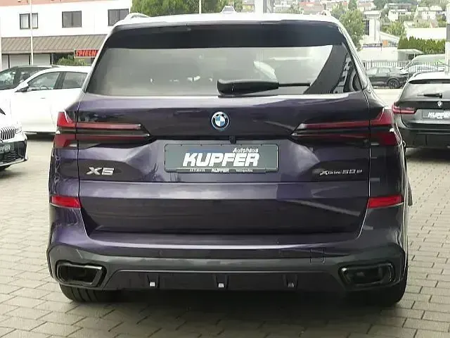 Gebraucht BMW X5 Performance 489 PS (359 kW) 2024 Sonderlack techno violett SUV