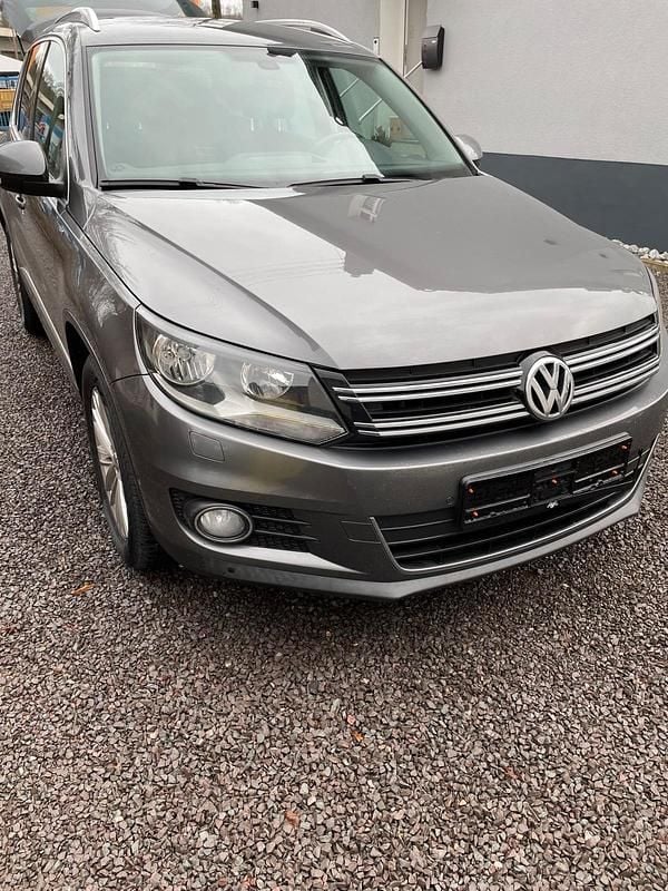 Grau Gebraucht 2014 VW Tiguan SUV | 9.999 € (Fairer Preis) - Bild 1/4