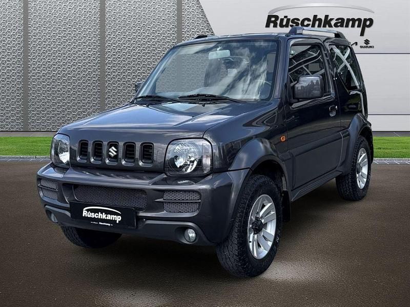 Grau Gebraucht 2011 Suzuki Jimny Style SUV | 15.980 € (Teuer) - Bild 1/4