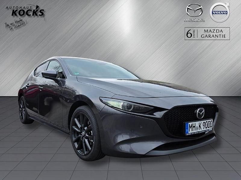 Machine gray Gebraucht 2024 Mazda 3 Exclusive-Line Kleinwagen | 28.990 € (Fairer Preis) - Bild 1/4