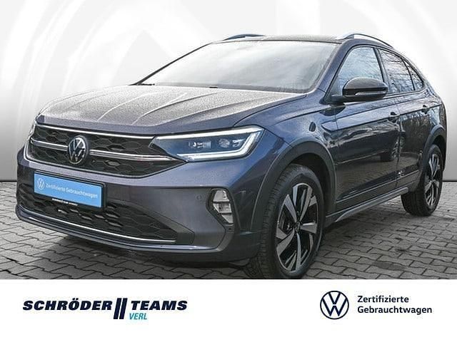 Grau (rauchgrau metallic) Gebraucht 2024 VW Taigo Style SUV | 23.980 € (Fairer Preis) - Bild 1/4